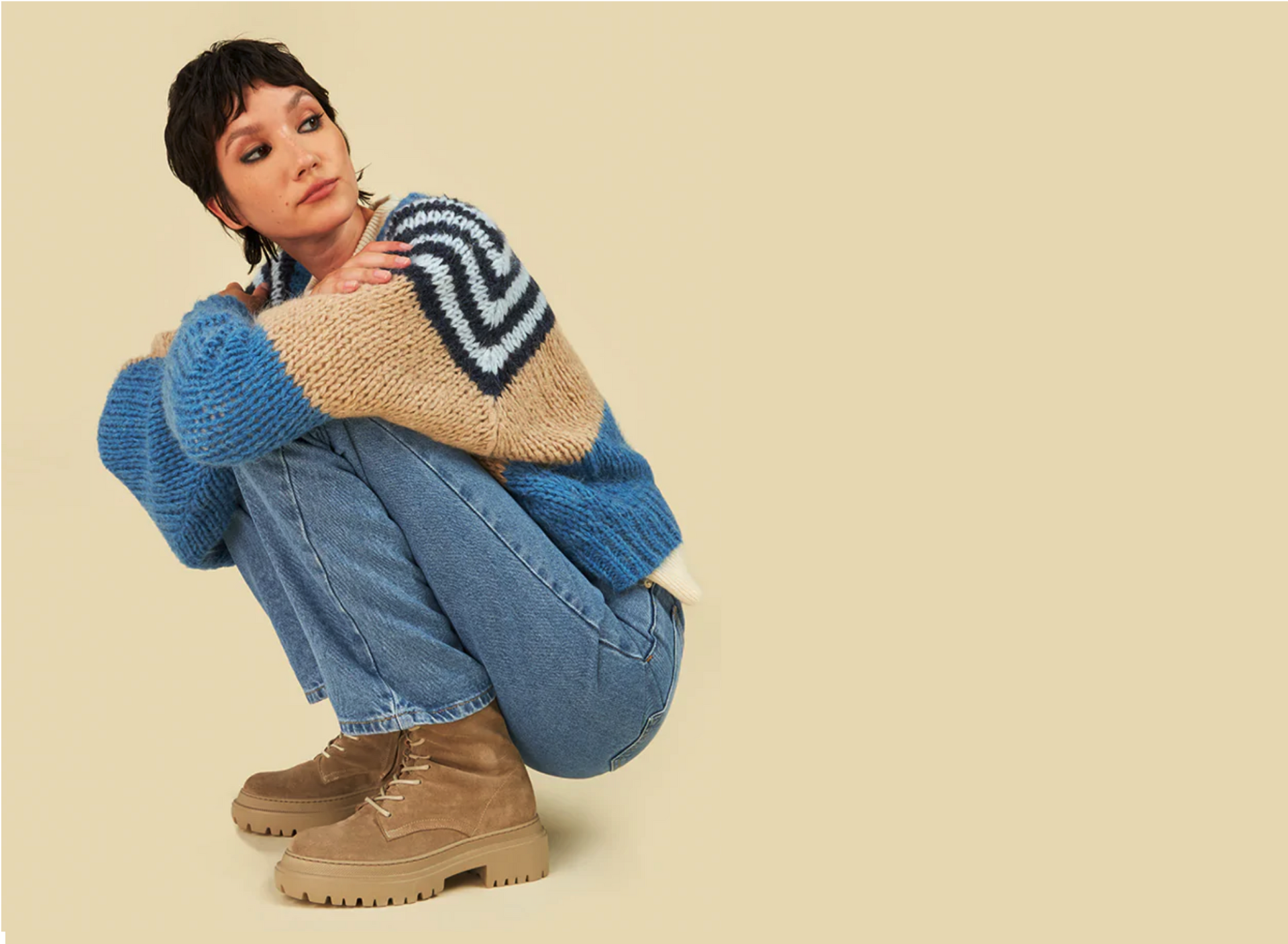 A woman wearing the Belluno suede boots.