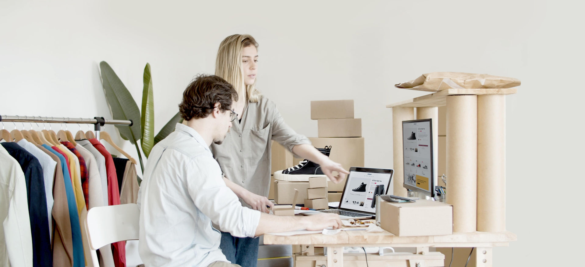 A couple building their online store using the Upscale theme on Shopify